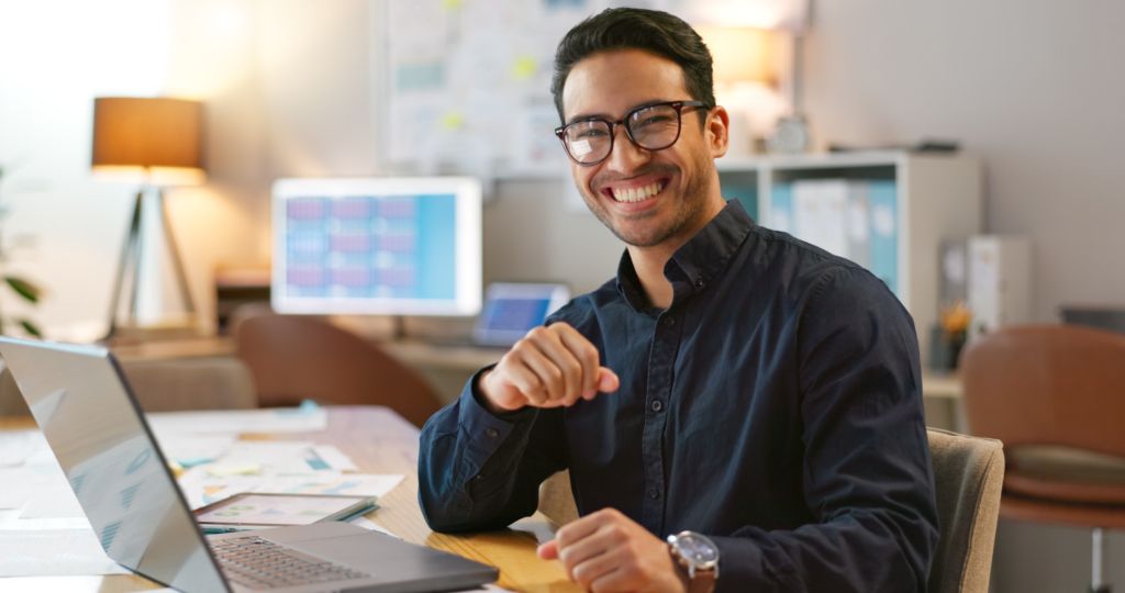 portrait-of-happy-man-in-office-typing-on-laptop-2025-04-05-14-57-58-utc-1024x540.jpg